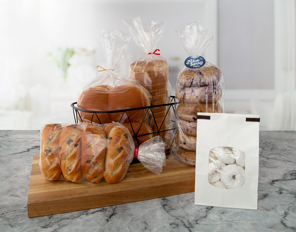 5 baked good items, including buns, rolls, bagels, bread, and powdered donuts, closed by Bedford twist tie, clip band, double wire tin-tie and CloseIt tag solutions.