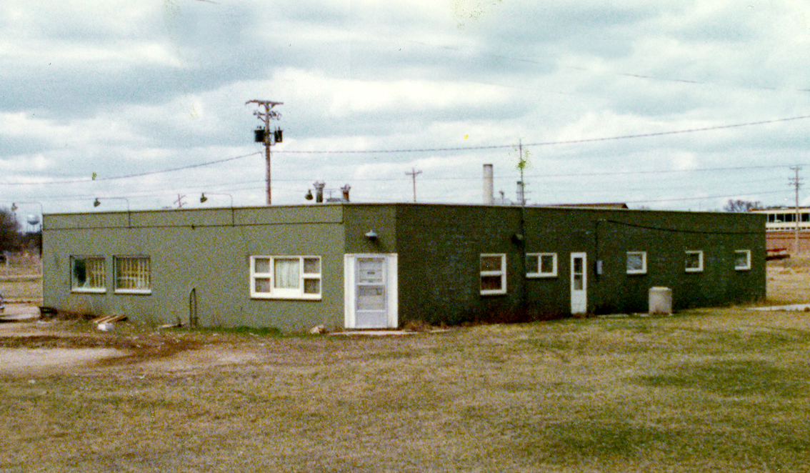 A grainy photo of a green garage.