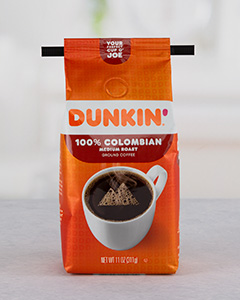 Orange Dunkin' coffee bag, "100% COLUMBIAN" flavor with black Peel & Stick tin tie.
