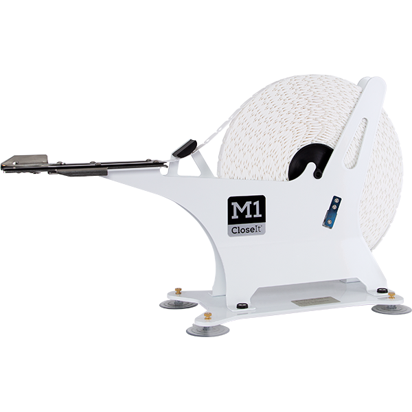 Bedford M1 Bag closure machine with spool of bag closures.