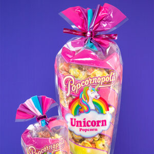 Hot pink metallic cut ties with “Popcornopolis” printed on them secure two bags of unicorn popcorn.